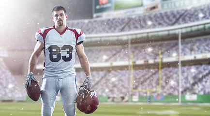 Image showing American Football Player isolated on big modern stadium field