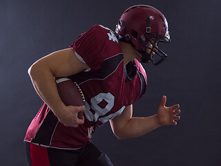 Image showing American football Player running with the ball