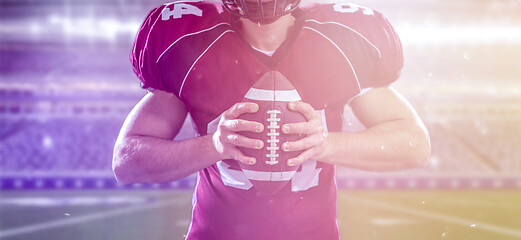 Image showing American Football Player isolated on big modern stadium field