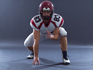 Image showing American football player getting ready before starting