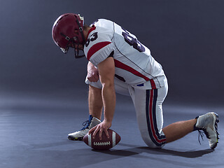 Image showing American football player getting ready before starting