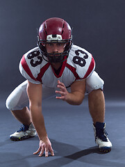 Image showing American football player getting ready before starting
