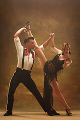 Image showing Flexible young modern dance couple posing in studio.