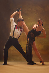 Image showing Flexible young modern dance couple posing in studio.