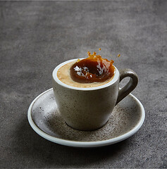 Image showing coffee splashing in a cup