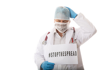 Image showing Overwhelmed doctor advising to STOP THE SPREAD of infectious vir