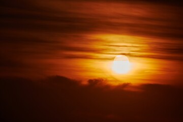 Image showing Sunset through cloudy red sky