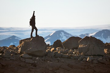 Image showing Standing on a cliff