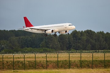 Image showing Plane landing on runway
