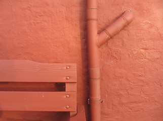 Image showing Detail of bench, pipe & wall