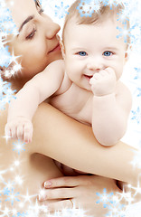 Image showing clean happy baby in mother hands