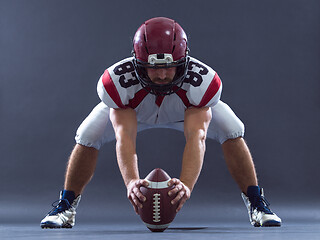 Image showing American football player getting ready before starting