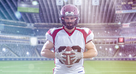 Image showing American Football Player isolated on big modern stadium field