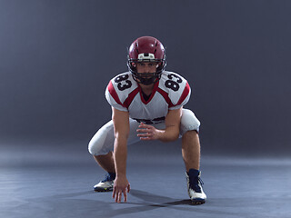 Image showing American football player getting ready before starting