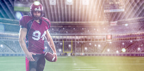 Image showing American Football Player isolated on big modern stadium field