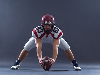 Image showing American football player getting ready before starting