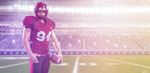 Image showing American Football Player isolated on big modern stadium field