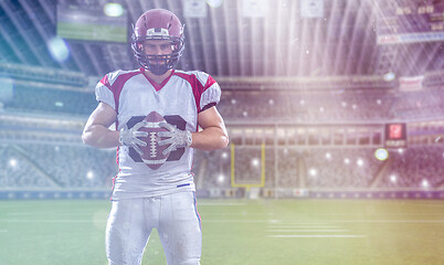 Image showing American Football Player isolated on big modern stadium field