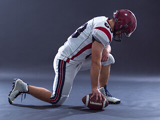 Image showing American football player getting ready before starting