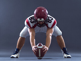 Image showing American football player getting ready before starting