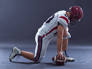 Image showing American football player getting ready before starting