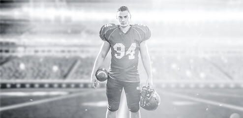 Image showing American Football Player isolated on big modern stadium field