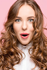 Image showing Surprised happy beautiful woman looking in excitement.