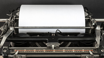 Image showing Vintage typewriter with blank sheet of paper retro technology