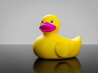 Image showing yellow rubber duck with pink mouth and green eyes