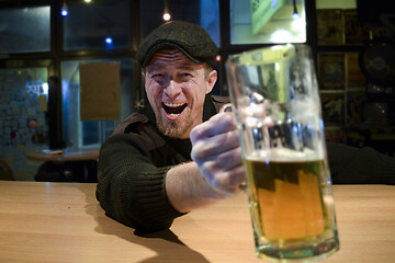 Image showing Guy with beer in the bar
