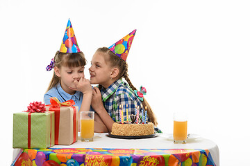 Image showing Birthday girl tells secrets to another girl