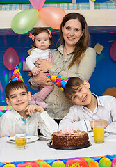 Image showing Portrait of mom and three children at a birthday celebration