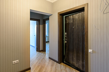 Image showing Entrance door to the apartment and interior doors to different rooms, view from the corridor