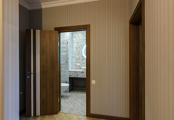Image showing Open door to the toilet, view from the corridor