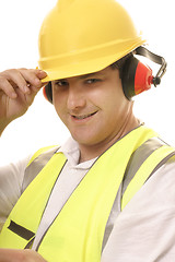 Image showing Friendly tradesmen tipping his hat