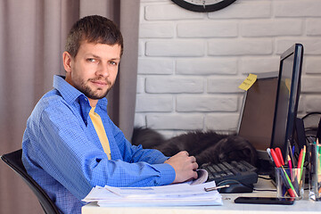 Image showing Portrait of a self-employed man working remotely