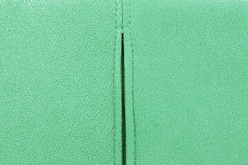 Image showing Background from green suede close up, zipper in the middle