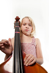 Image showing Portrait of a young teenager girl in studio with a cello