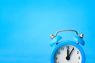 Image showing Clock concept - time, left empty place, blue background