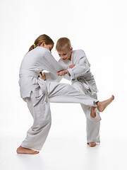 Image showing Two judo students try to hook each other up