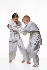 Image showing Boy and girl fight and try to make each other\'s cuts