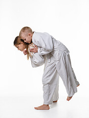 Image showing Judo student girl learns to perform throw through the thigh