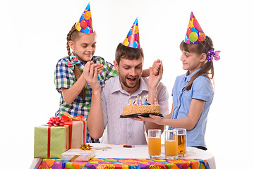 Image showing Dad is very happy about the festive sweet surprise prepared by the children