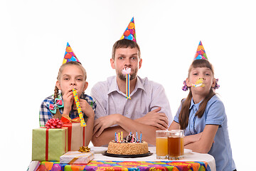 Image showing Kids at birthday party have fun blowing whistles