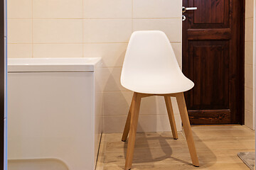 Image showing Bathroom interior with bath and stool