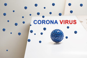 Image showing Shot of microscope virus close up. Coronavirus concept Tablet in the fingers of hand