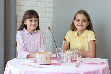 Image showing Children sit at the table and prepare for the celebration of Easter