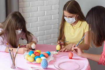 Image showing Quarantined sick family paints eggs for Easter