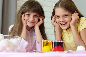 Image showing Children wait until Easter eggs turn colored and have fun looking at the frame