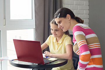 Image showing Mom and child do homework together without leaving home